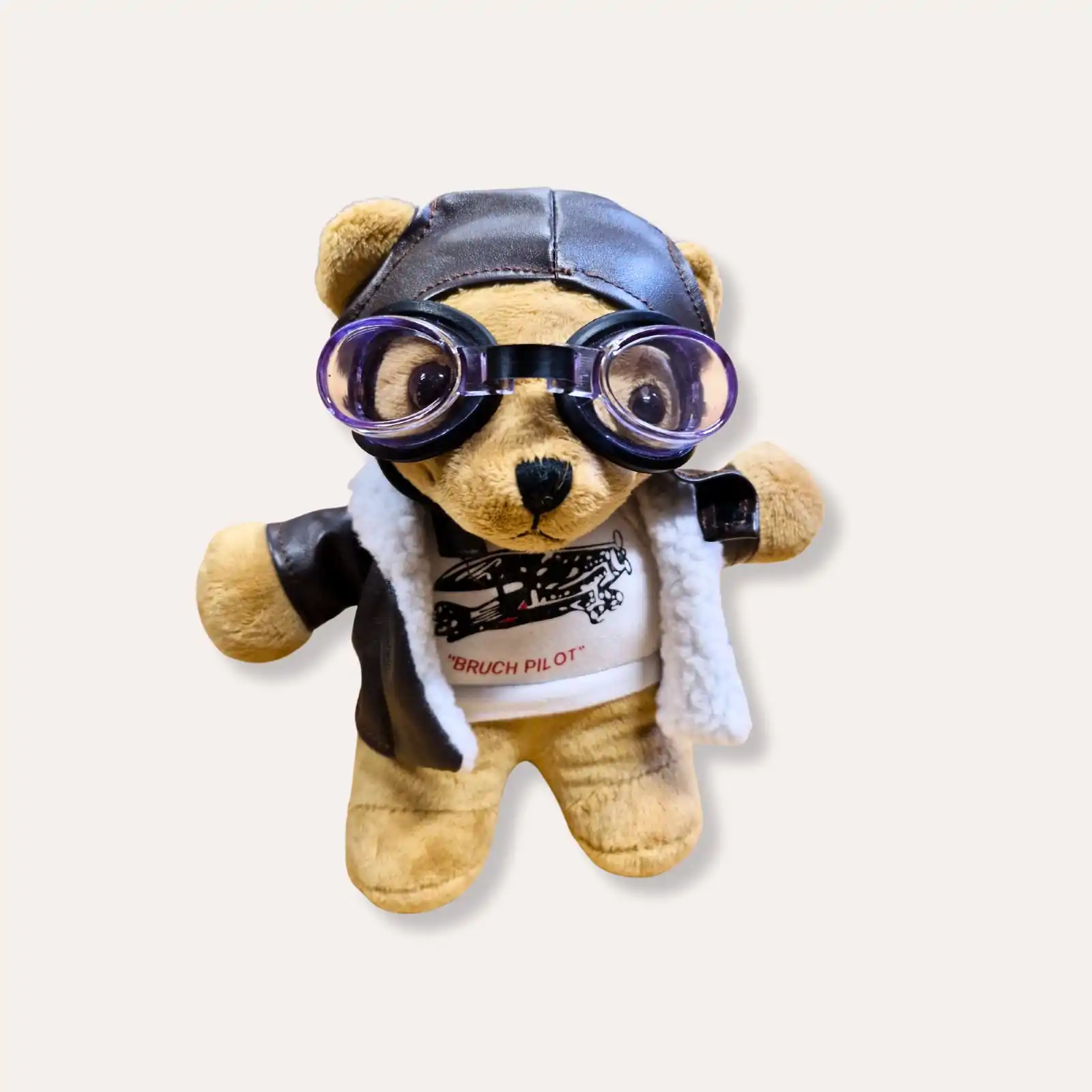 Ourson aviateur en peluche